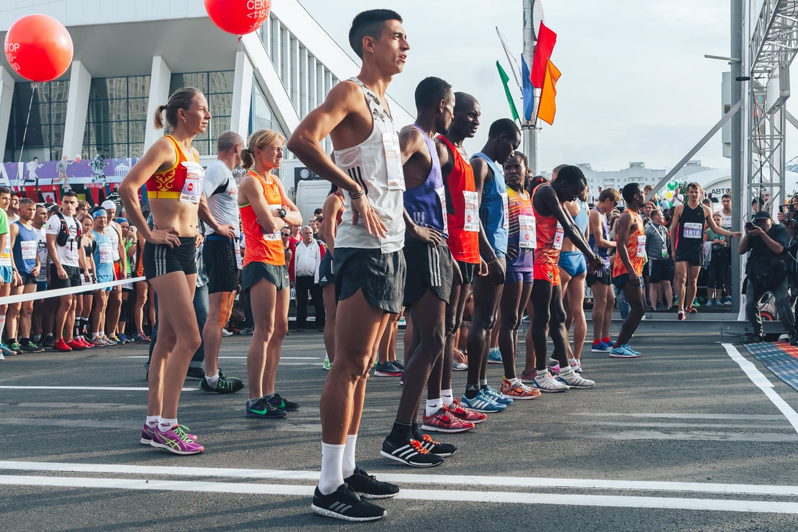 Skinny elite runners before the race starts.