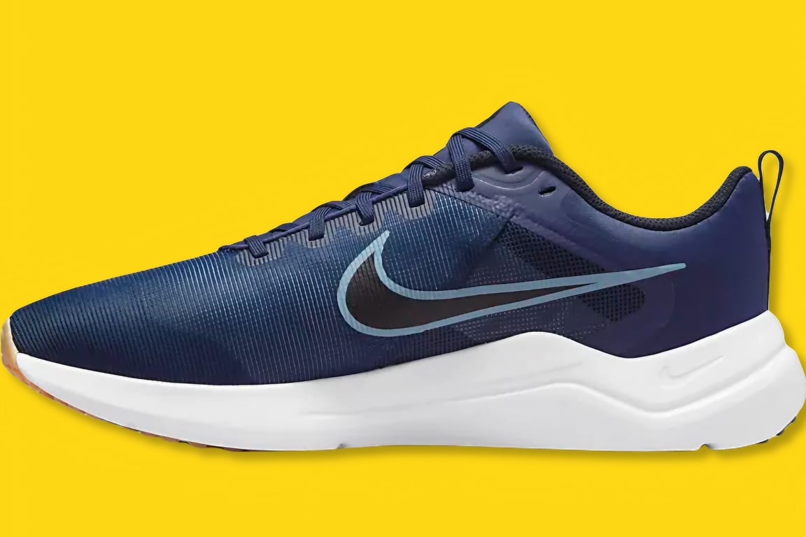 The Nike Downshifter running sneaker from a side view.