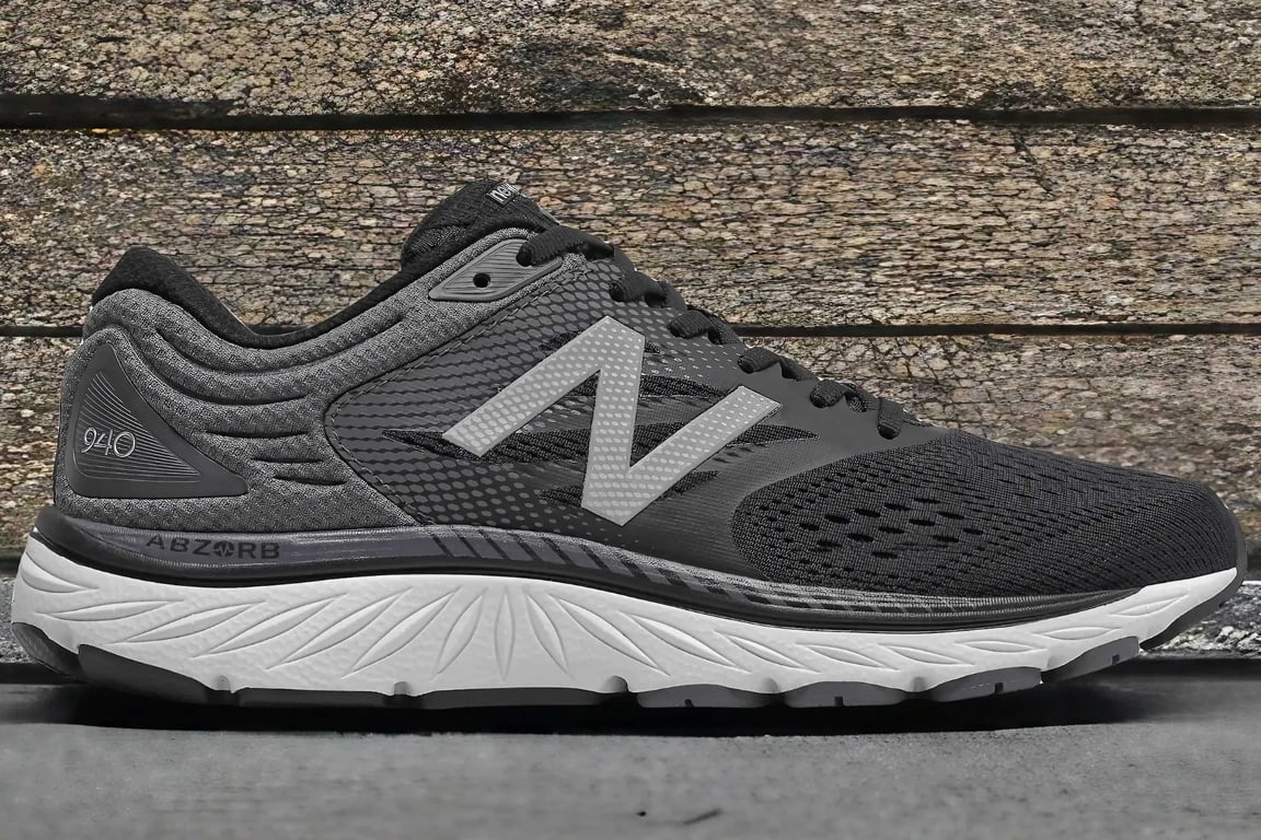 The New Balance 940 running sneaker on pavement.