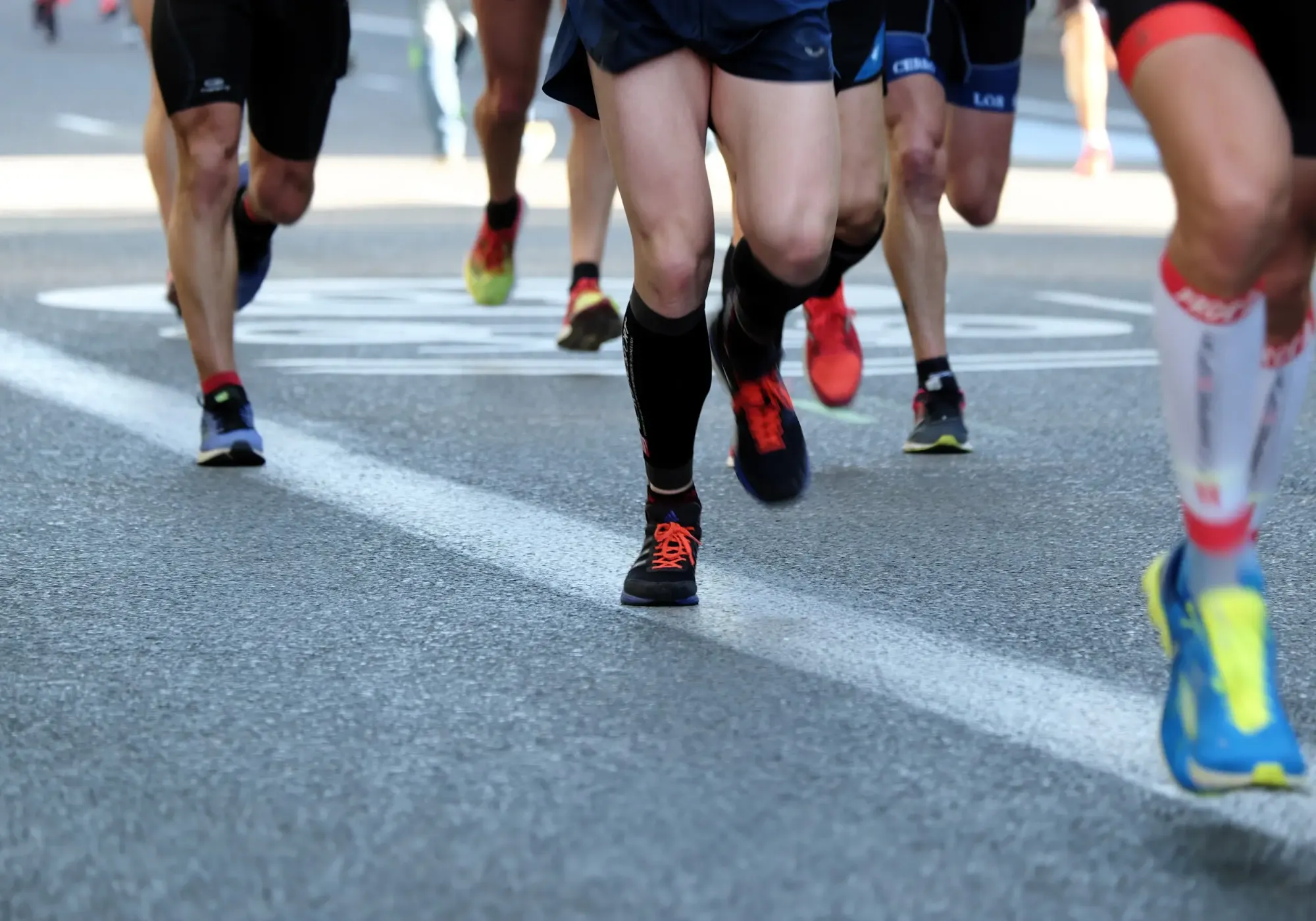 Runners' legs during a road running race.