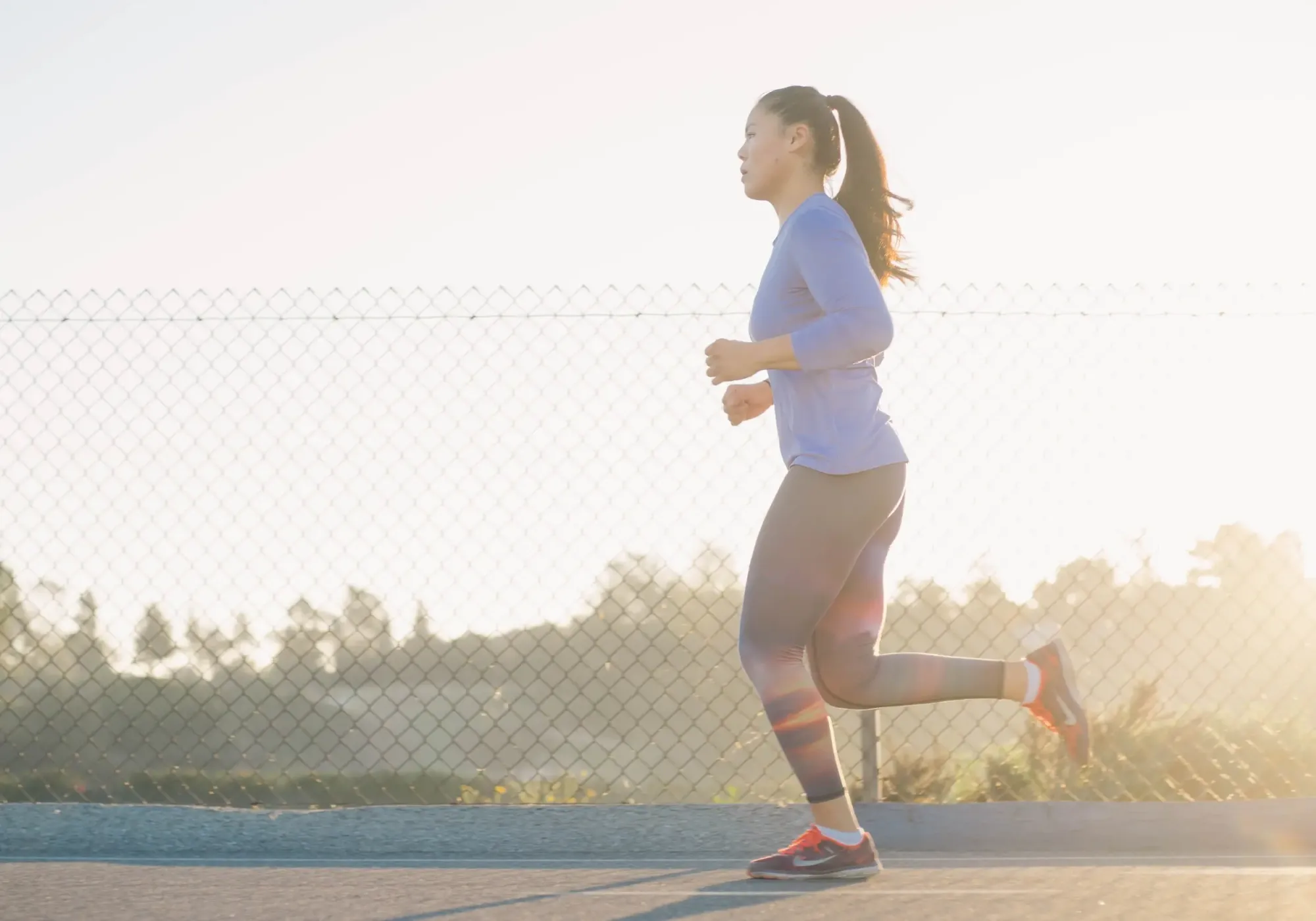 Women jogging on a road.